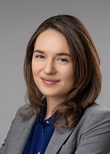 Danielle Bitterman against a gray background.